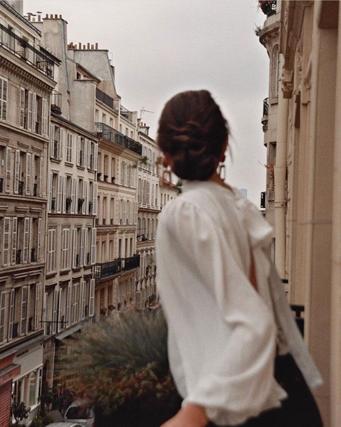 Woman looking at Parisian street